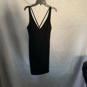 All black dress with straps on the back